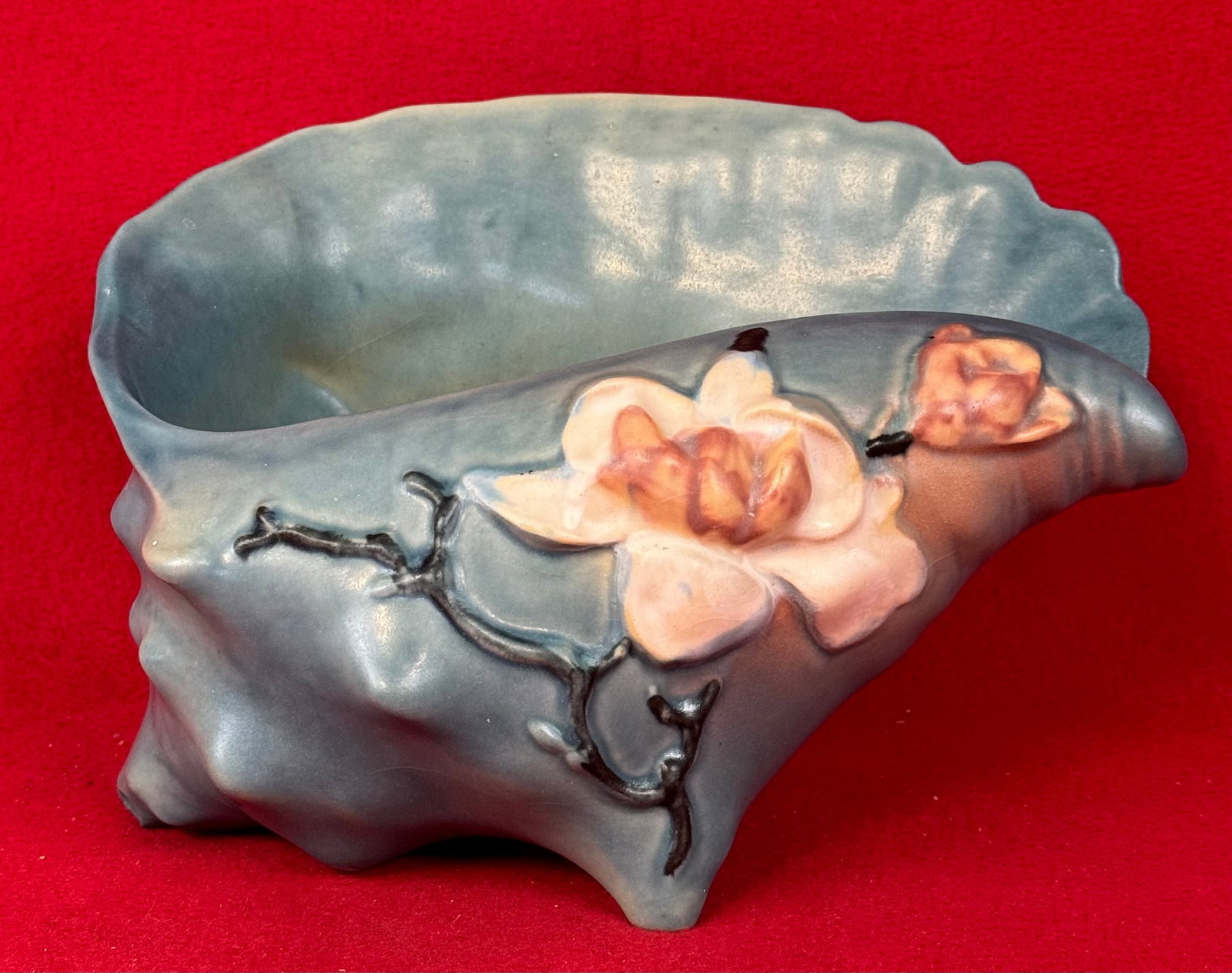 Roseville Blue Magnolia 454-8" Conch Shell: Original Roseville 454-8" Conch Shell in the Magnolia pattern which dates to 1943. Shell is marked on underside of the base in relief Roseville / U.S.A. / 454-8" and is in the blue coloration. Conch S