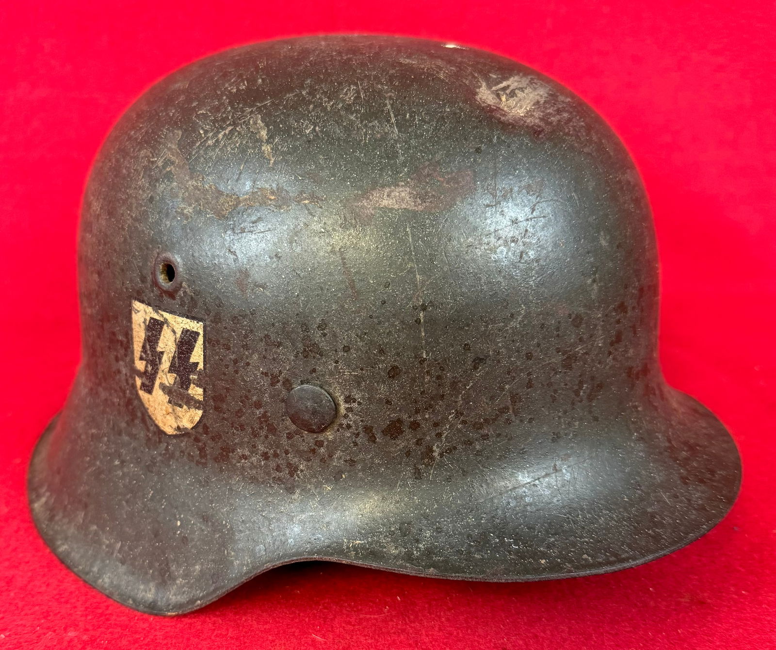 German Waffen SS Model 42 Single Decal Helmet / Named: German WW2 Waffen SS Model 42 single decal helmet which has written in white paint on the interior with Kan. Bodsch. Helmet has dark field gray finish and appears to have its original darkened leather