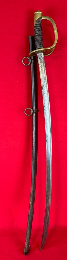 Ames Model 1860 Cavalry Sabre Dated 1864: Model 1860 Cavalry Sabre which was made by the Ames Manufacturing Company Chicopee Massachusetts. Sabre measures approximately 44" in total length with a 35" blade and has a brass guard with leather w