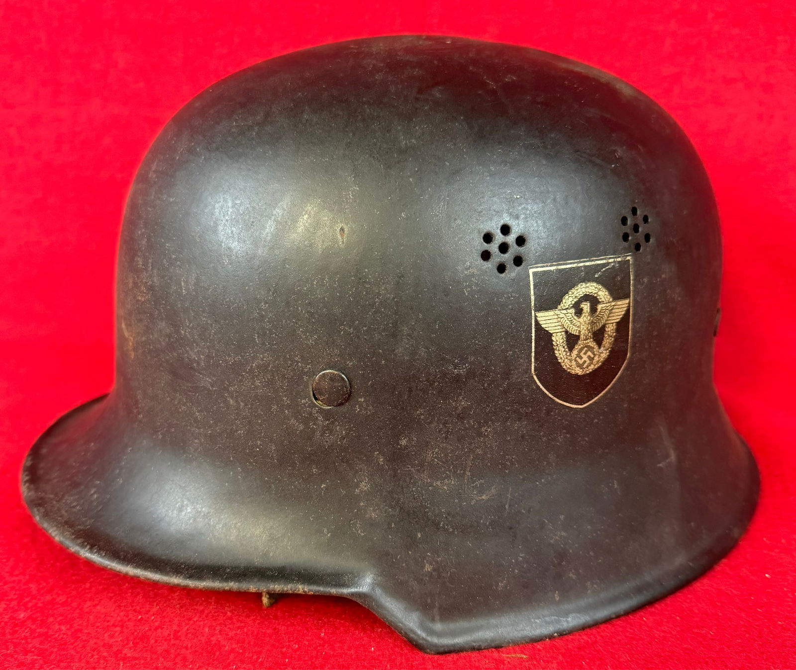German WW2 Civic Police Helmet: German World War Two Civic Police Helmet complete with both decals both of which are in excellent condition. Helmet has its original oil cloth like liner along with partial leather chinstrap and a int
