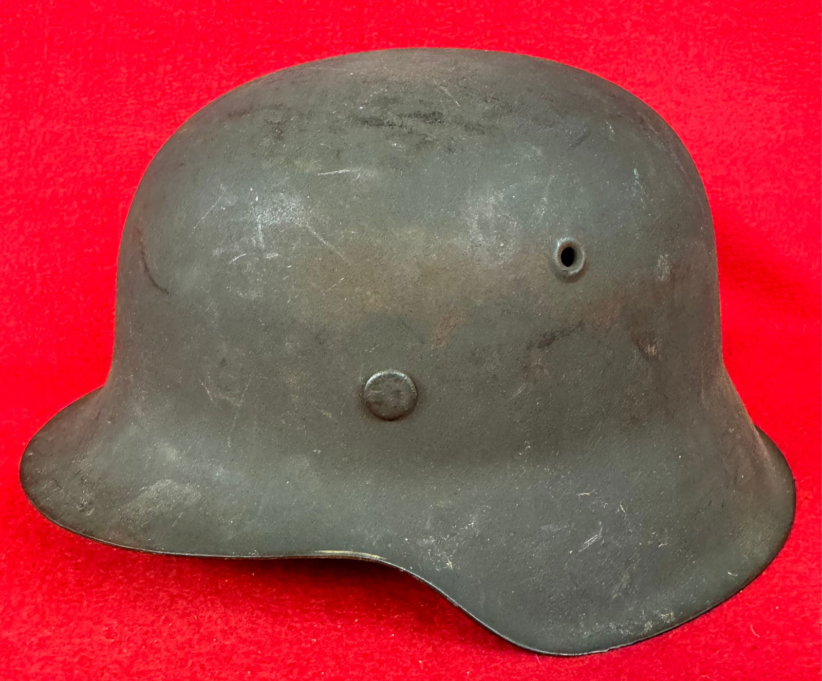 German WW2 Model 42 Army Helmet: German World War Two Model 42 Army Helmet with field gray finish. Helmet has makers ink stamp on the interior crown and is stamped 4704 etc. on the interior of the neck flange. Condition - fine but li