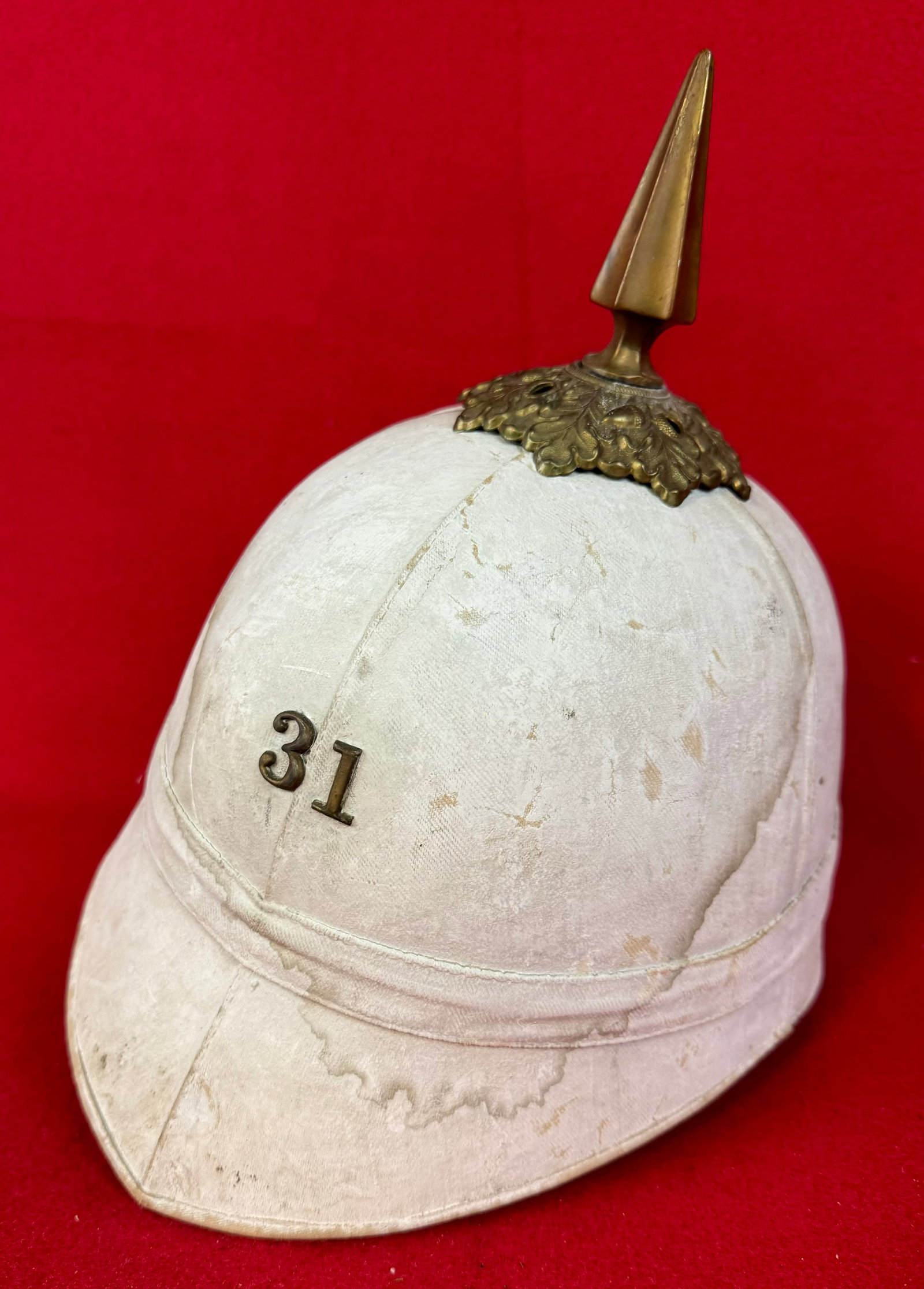 American Model 1880 Pith / Sun Helmet by J H McKenney & Co NY: American model 1880 pith or sun helmet with white painted surface and the number 31 in brass on the front which most likely refers to a New York National Guard regiment. Helmet was made and is marked