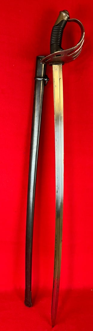 19th C Chatellerault Chilean Cavalry Sword: Circa 1898-1900 Chilean Cavalry sword by Chatellerault with steel guard and steel scabbard. Sword is approximately 35 1/4" blade and is marked on the spine Manufacture d'Armes De Chatellerault along w