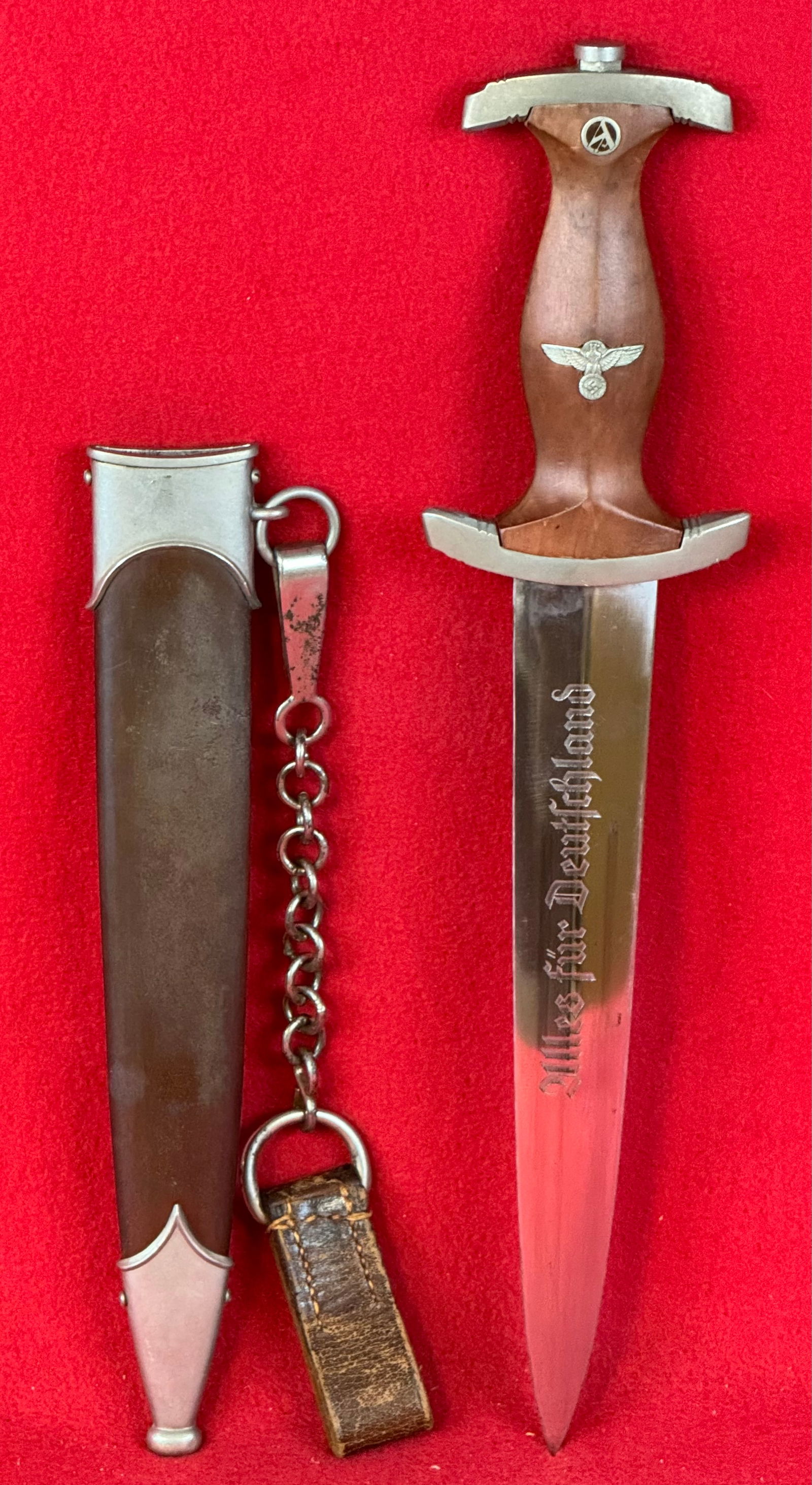 WW2 SA Dress Dagger By Hermann Hahn: World War Two Nazi German SA dress dagger with sheath and hanger. Dagger is marked at base of its double edged spear point blade by the maker Hermann Hahn. Dagger has motto in German "Everything for G