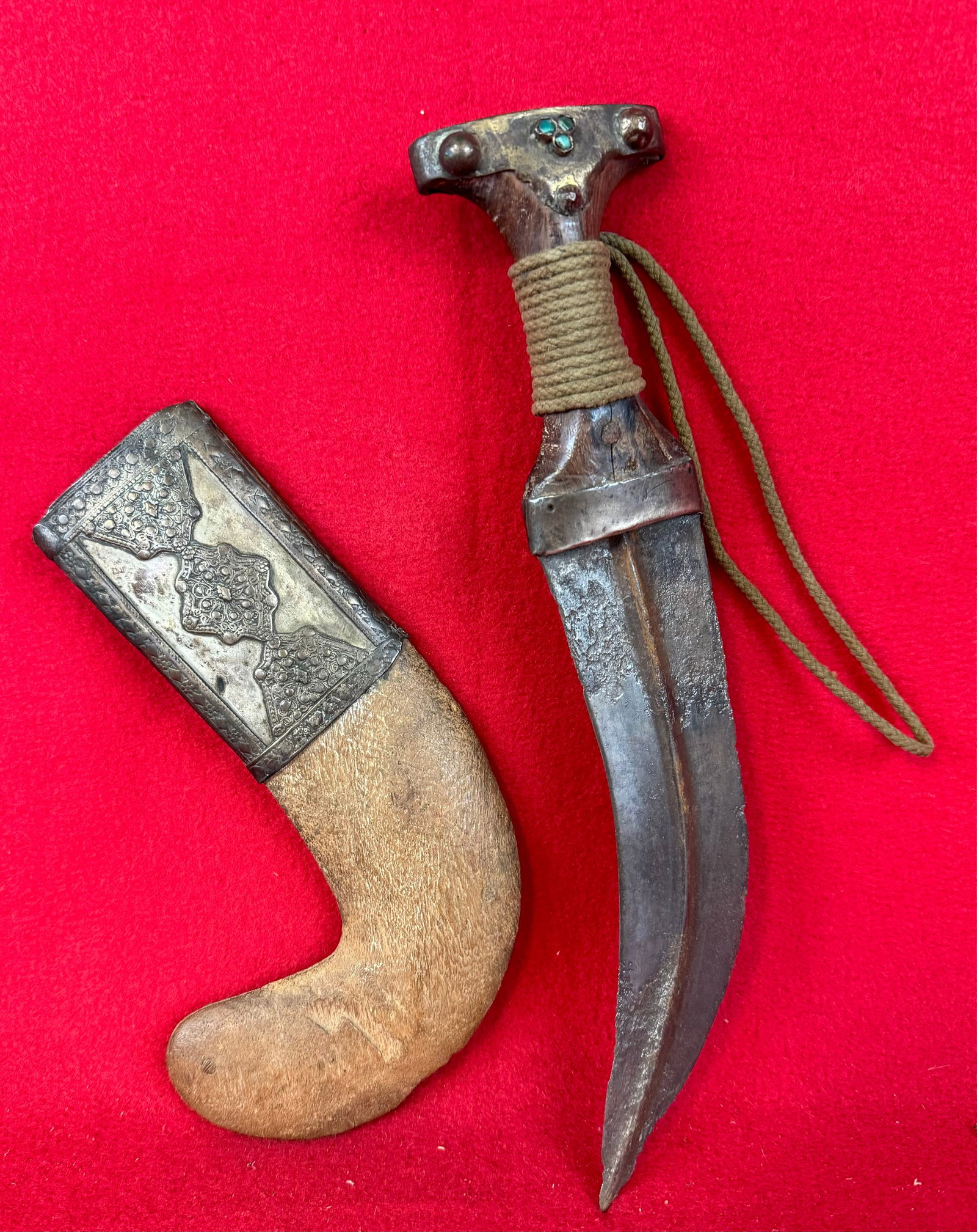 Antique Islamic Khanjar Dagger: Antique Islamic Khanjar Dagger with sheath which measures approximately 11 1/2" in total length and which is decorated with silvered brass on sheath at throat and on the end of the grip. Condition - s