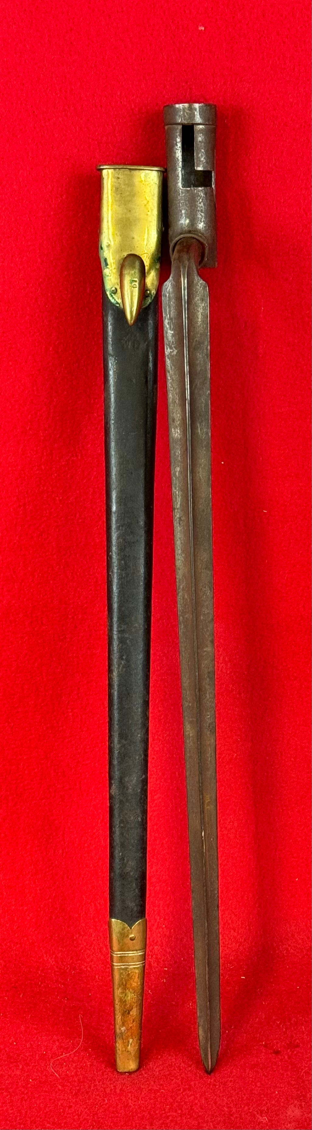 Civil War Socket Bayonet With Leather Scabbard: Civil War socket bayonet with its leather with brass tip and throat scabbard. Bayonet is marked US on tang. Condition sheath / scabbard is fine while bayonet has some light surface oxidation but nothi