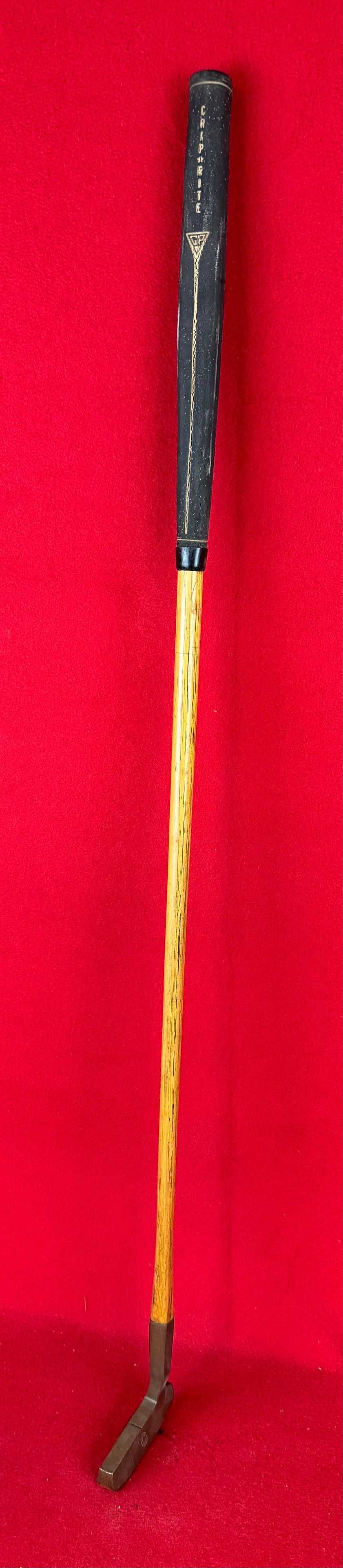 Vintage Otey Crisman35H Brass Headed Putter: Vintage marked Otey Crisman 35H brass headed putter on a hickory shaft with black rubberized Grip Rite grip. Condition - is as shown.