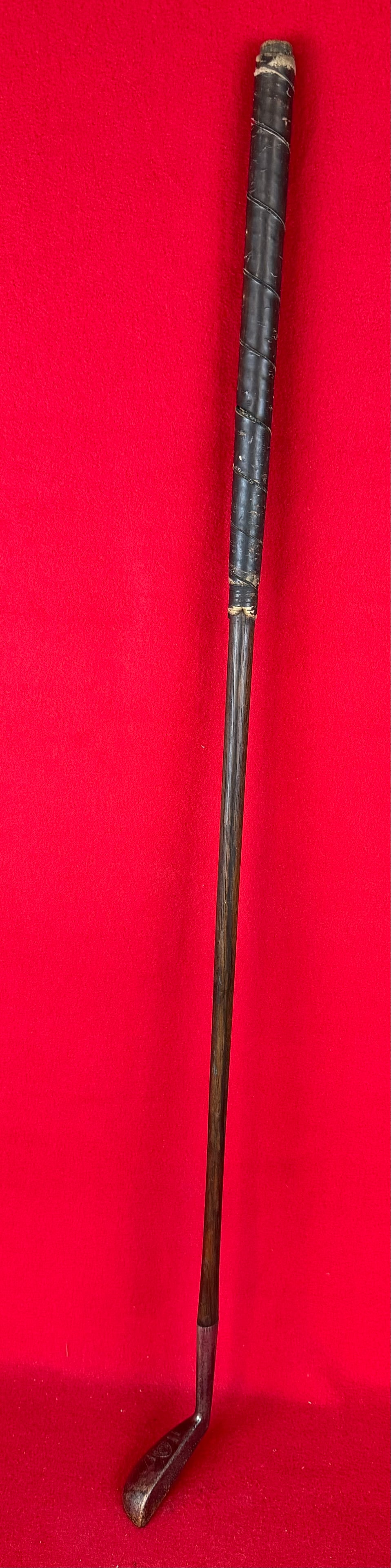 Antique Wright & Ditson BV Special Putter: Antique hand forged steel headed Wright and Ditson BV Special gold putter with a hickory shaft and having a dark brown leather wrapped grip. Condition - is as shown.