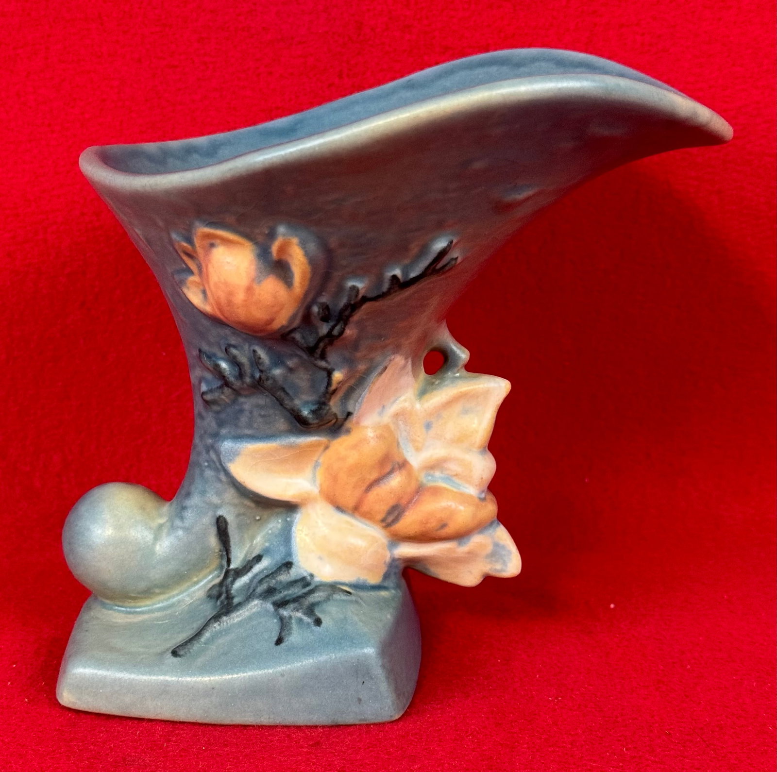 Roseville Blue Magnolia 184-6" Cornucopia Vase: Original Roseville 184-6 cornucopia vase in the Magnolia pattern which dates to 1943. Vase is marked on underside of the base in relief Roseville / U.S.A. / 184-6" and is in the blue coloration. Vase