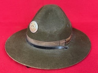 WW2 US Army Drill Sergeant Hat: World War Two United States Army Drill Sergeant Hat made from dark olive green felt with leather sweatband and original chinstrap along with a two piece silver and gilt eagle front insignia. Hat is in
