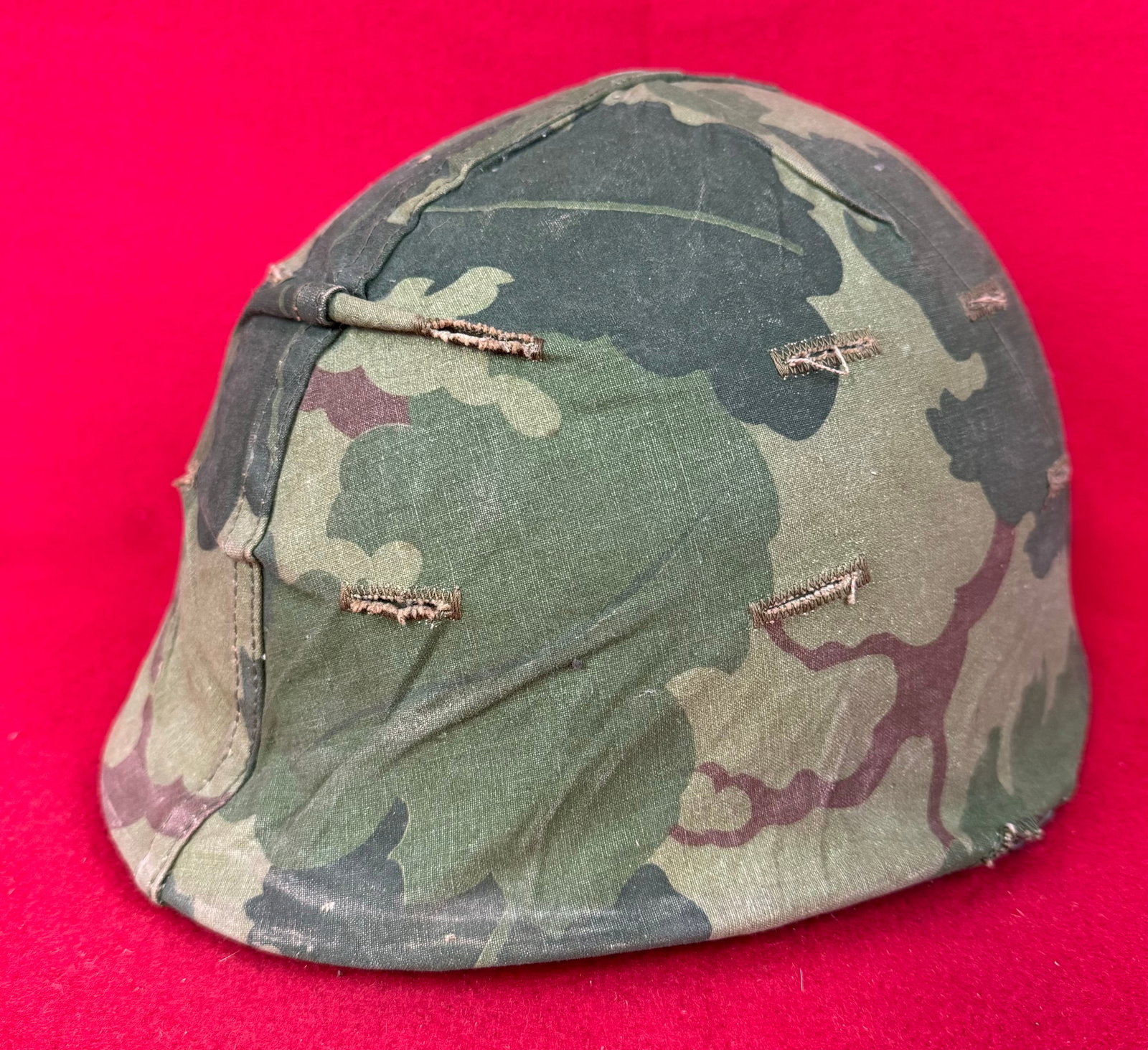 WW2 US M1 Army Helmet w Camouflage Covering: World War Two United States Army M1 helmet with liner and having a camouflage cloth covering. Helmet has swivel bails. Condition - fine with just some wear to the cloth camo as shown.