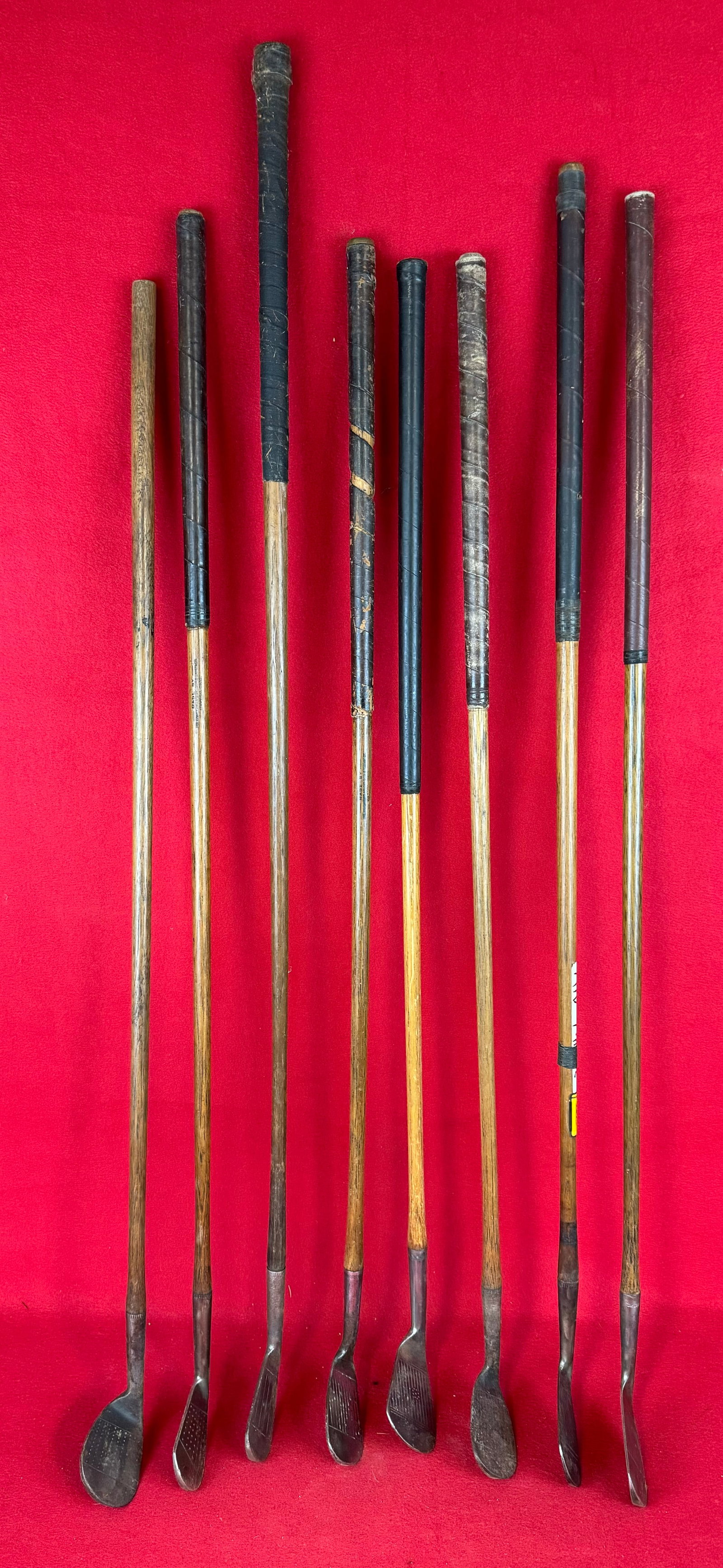 Lot 8 Antique Hickory Shafted Golf Clubs & Vintage Golf Bag: Lot of eight antique hickory shafted golf clubs and a vintage golf bag. Clubs include various cleek marks as shown in the photos. Condition - is as shown.