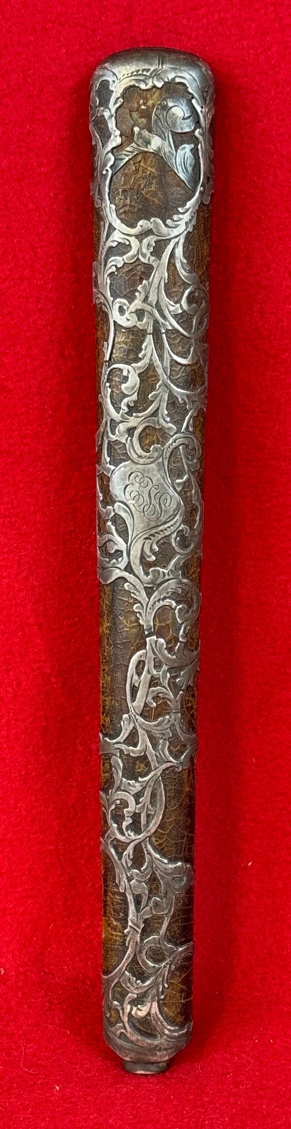 Ornate Victorian Sterling Silver Overlay Umbrella Handle: Ornate sterling silver overlay Victorian umbrella handle which measures approximately 11" long and is 1 3/8" at its widest. The sterling silver overlay appears to be over some type of leather and the 