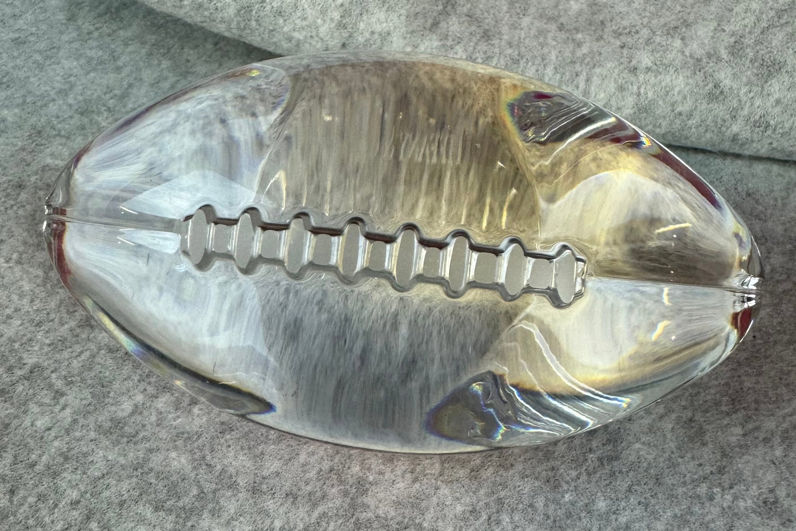 Tiffany & Co Crystal Football: Marked Tiffany & Co lead crystal figural football which measures approximately 4 1/4" long and is in excellent condition.