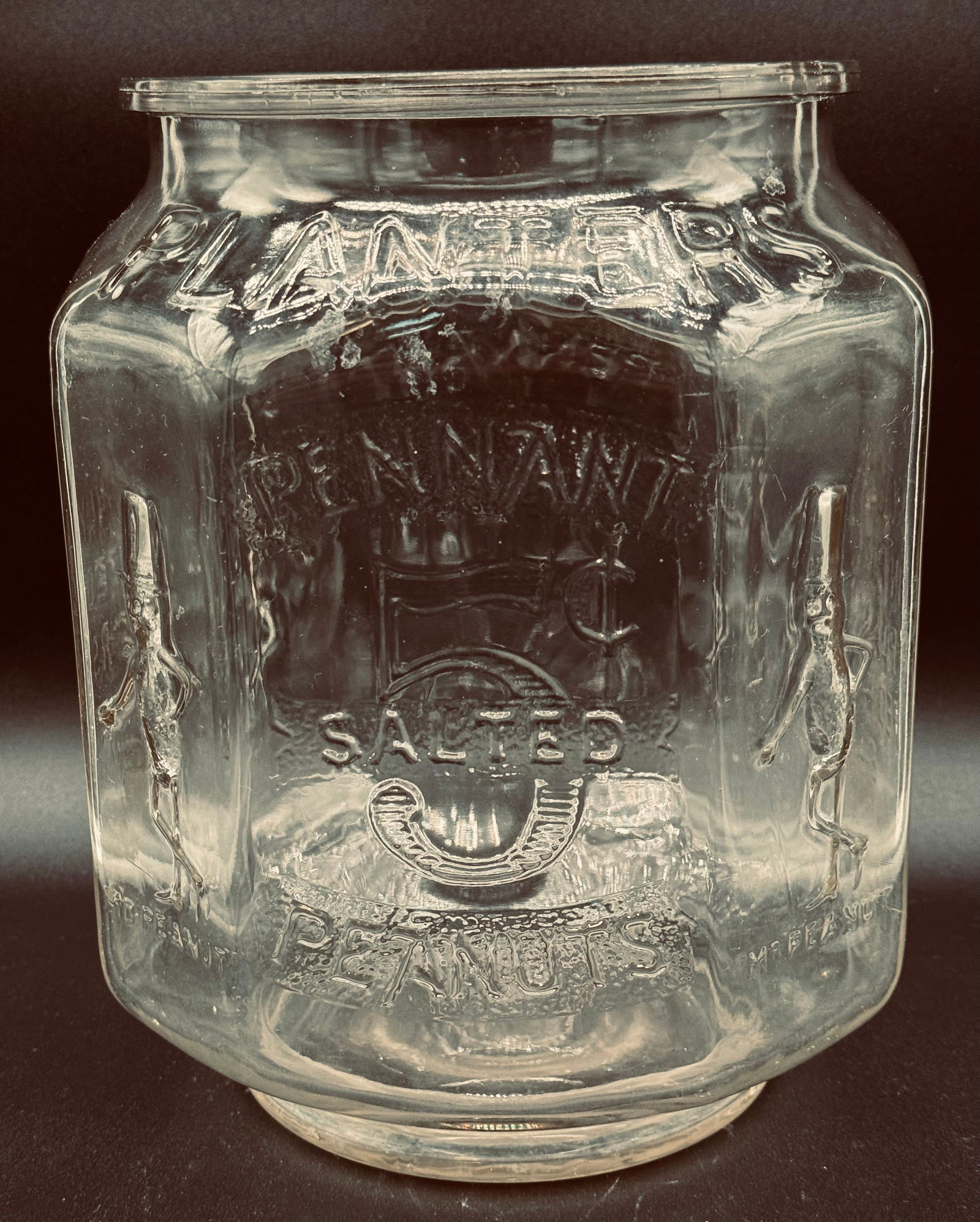 Original Planters Peanuts 5 Cents Red Pennant Octagon Store Jar: Original early 20th century Planters Peanuts clear glass red pennant 5 cents octagon form country store jar. Jar is free of chips, cracks but does have the slightest trace of interior haze in the lowe