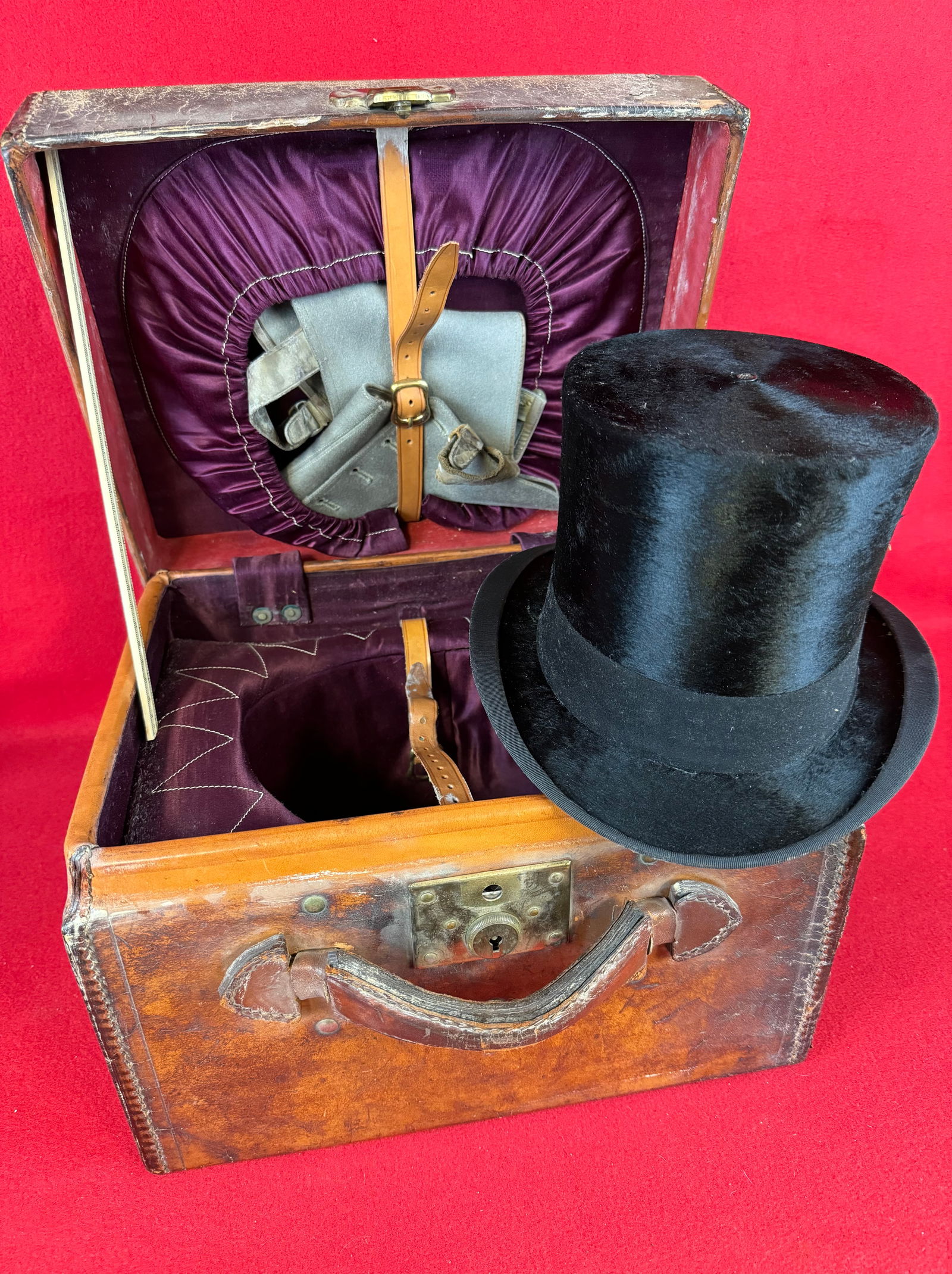 Top Hat & Spats In Leather Travel Case: Exceptional top hat and spats in their period leather covered travel case. Hat and spats are in fine condition while the brown leather covered travel case has some wear and soil to its surface as show