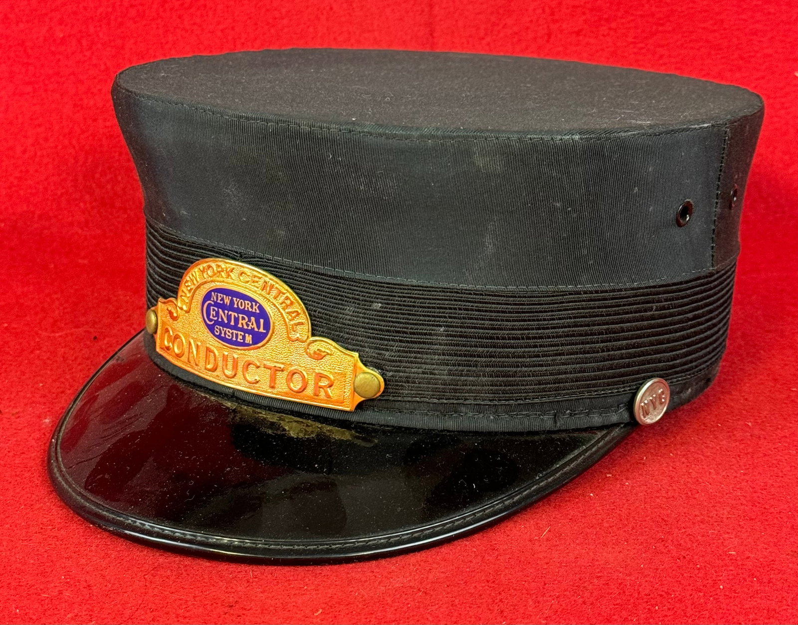 New York Central Railroad Conductors Cap With Cap Badge: Old New York Central Railroad conductors cap with its original enamel on stamped brass cap badge all in fine condition.