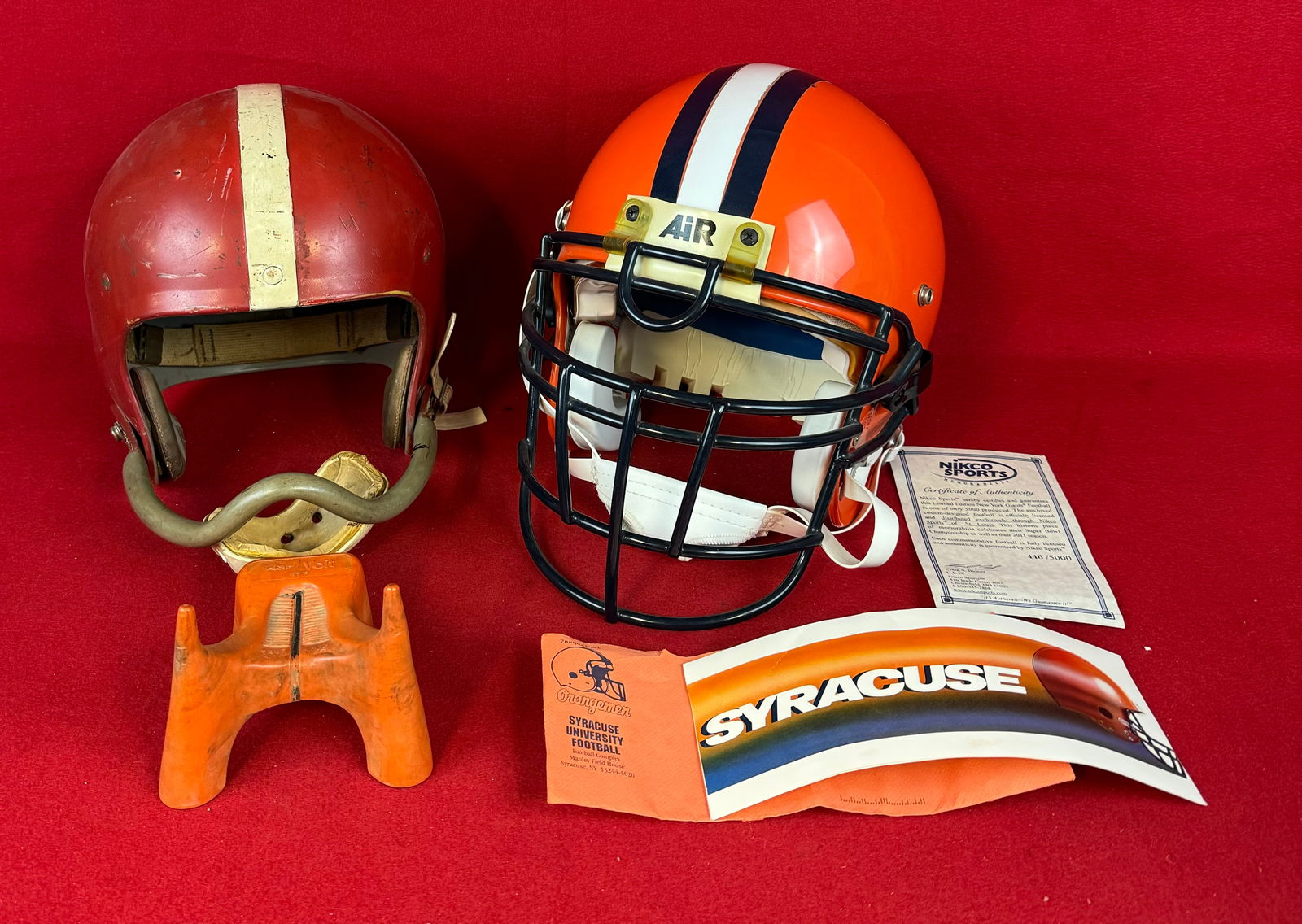 Syracuse University Football Helmet & Vintage Helmet Etc.: Lot which includes a Syracuse University Football helmet with a presentation note from the Syracuse University football coach in 1993 all in excellent condition along with a vintage football helmet wi