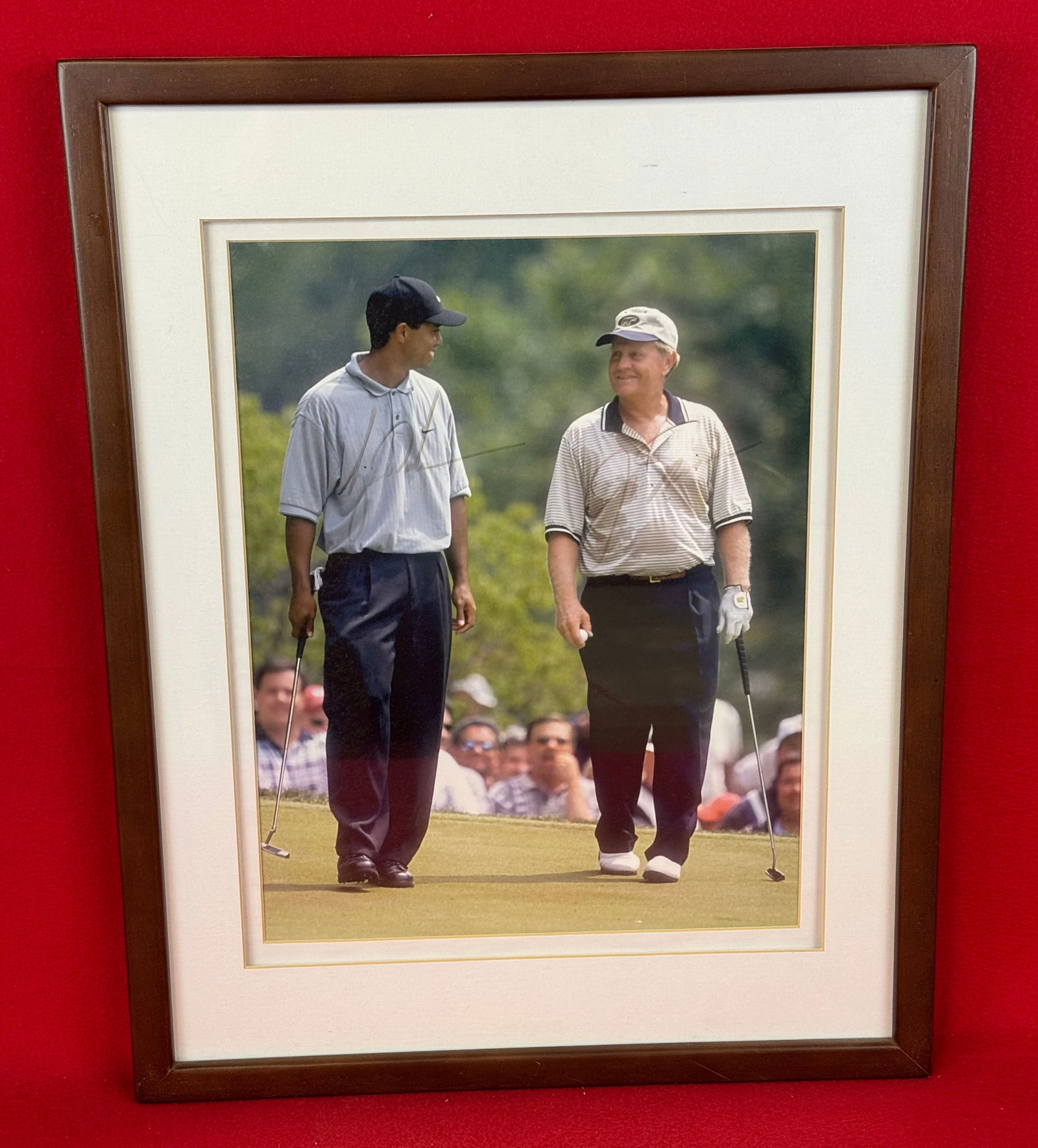 Autographed Framed Photo Tiger Woods / Jack Nicklaus: Framed autographed color photograph of the golf legends Tiger Woods and Jack Nicklaus. Frame measures approximately 19" by 15". Item comes with a COA from The Latest Obsession 134 Main Street Cooperst