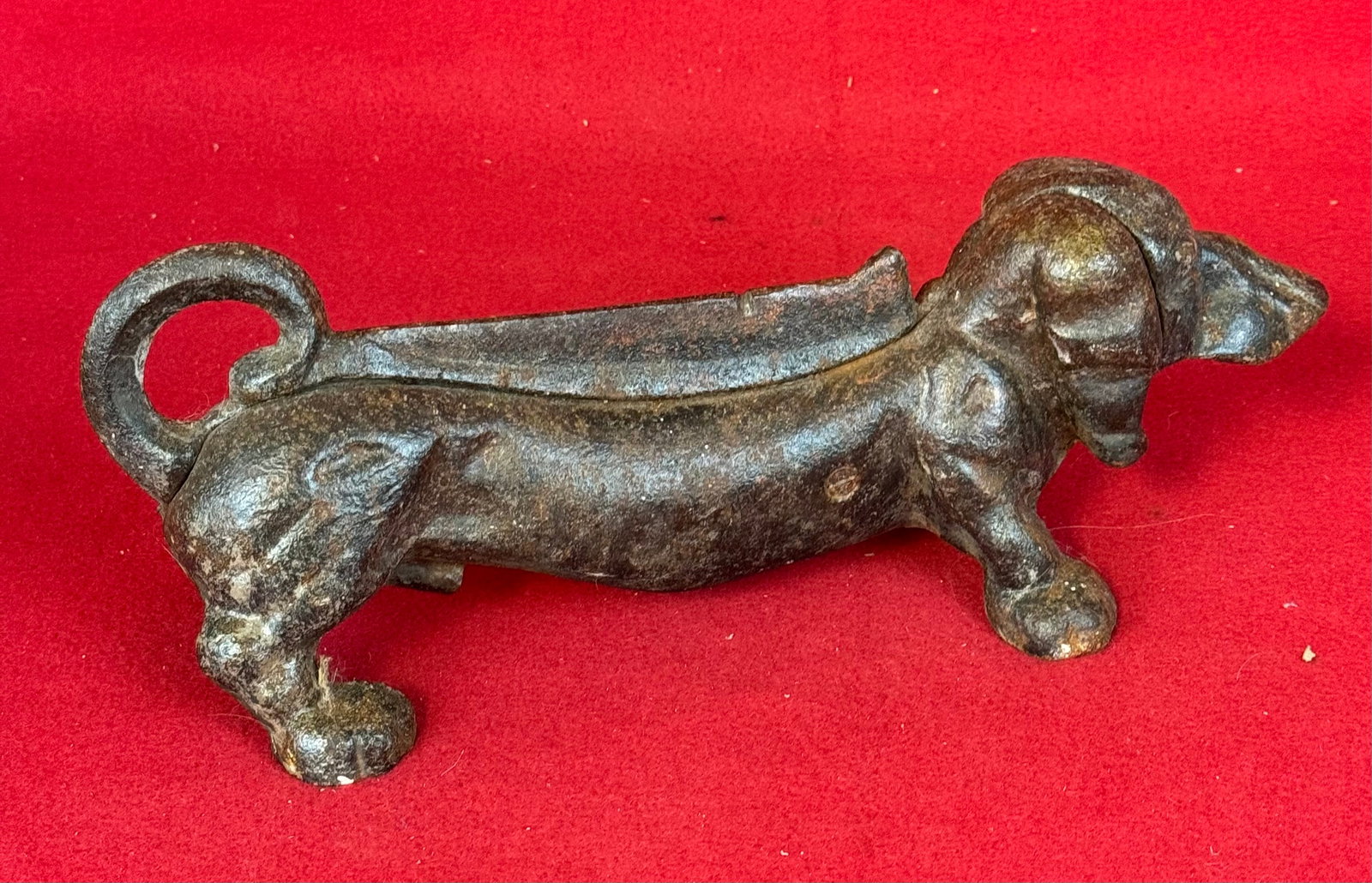 Dachshund Figural Cast Iron Boot Scraper: Cast iron figural boot scraper in the form of a dachshund dog which measures approximately 13" long. Condition - some oxidation to surface but not to excess.