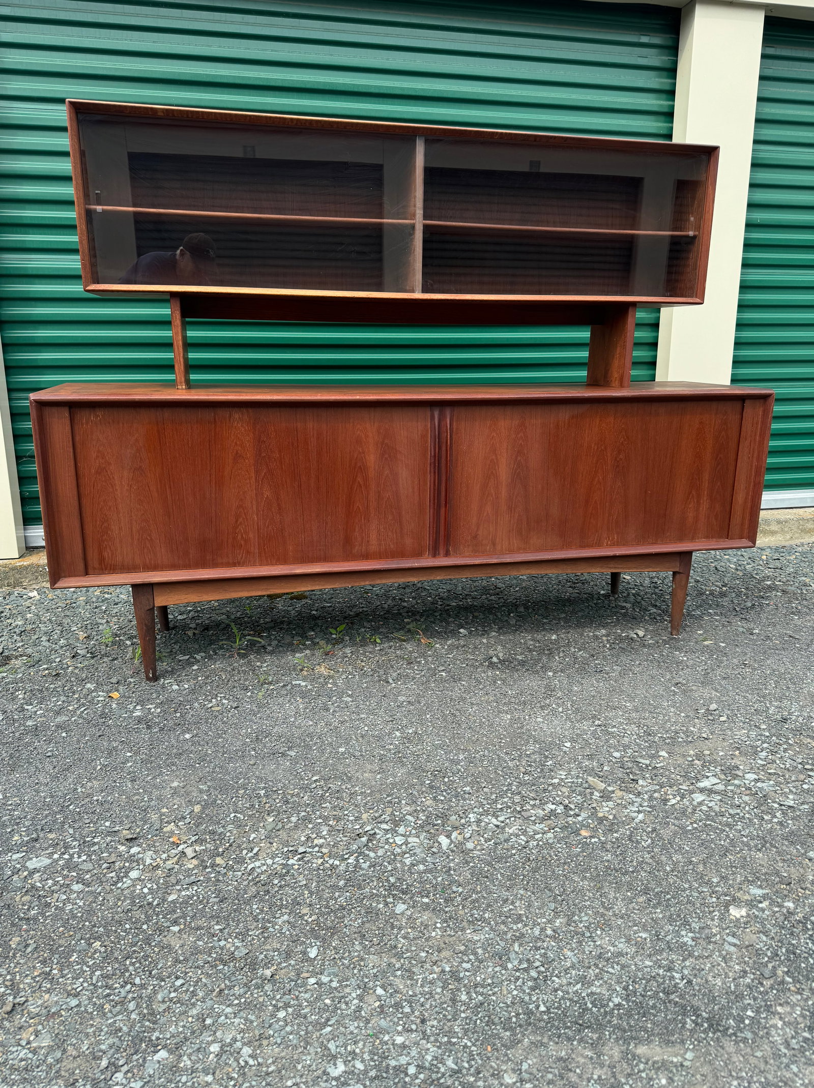 Danish Mid Century Modern Teakwood Credenza: Danish Mid Century Modern Teakwood Two-Piece Credenza / Sideboard, unmarked but possibly by Bernard Pedersen & Son. It was purchased by the original owner while in Copenhagen. The base is supported on