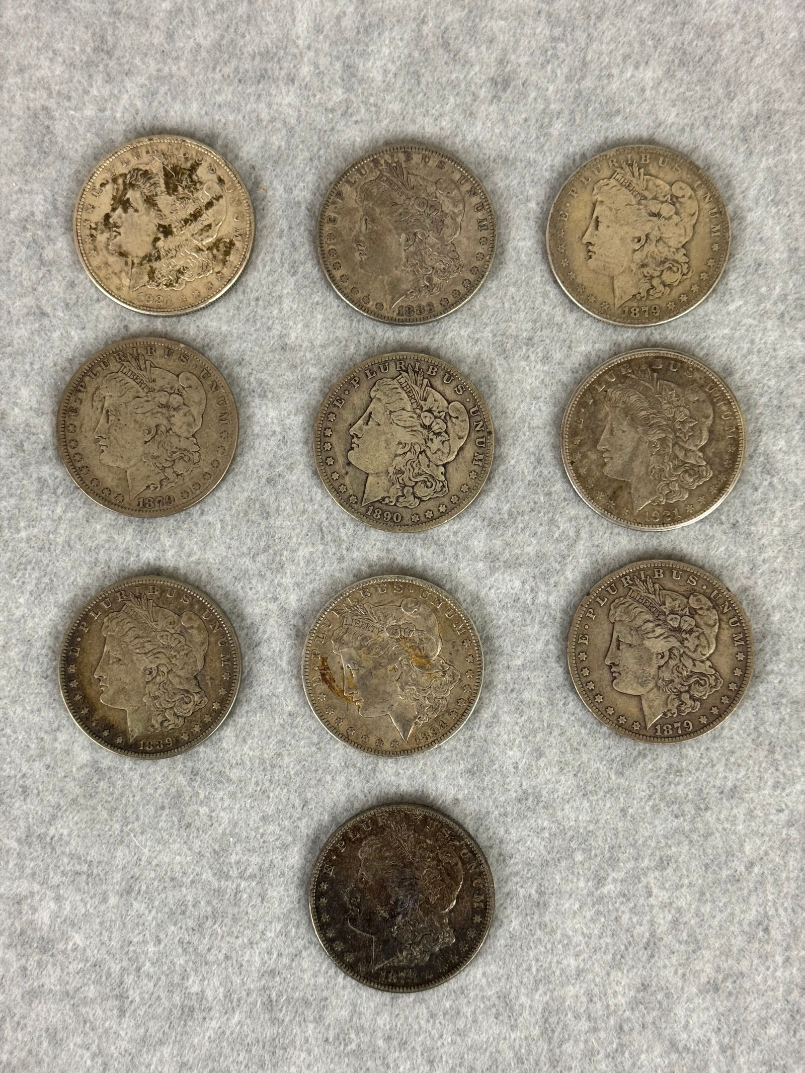 Lot 10 Morgan Silver Dollars: Lot of 10 Morgan Silver Dollars. Condition and mint marks as shown in photos