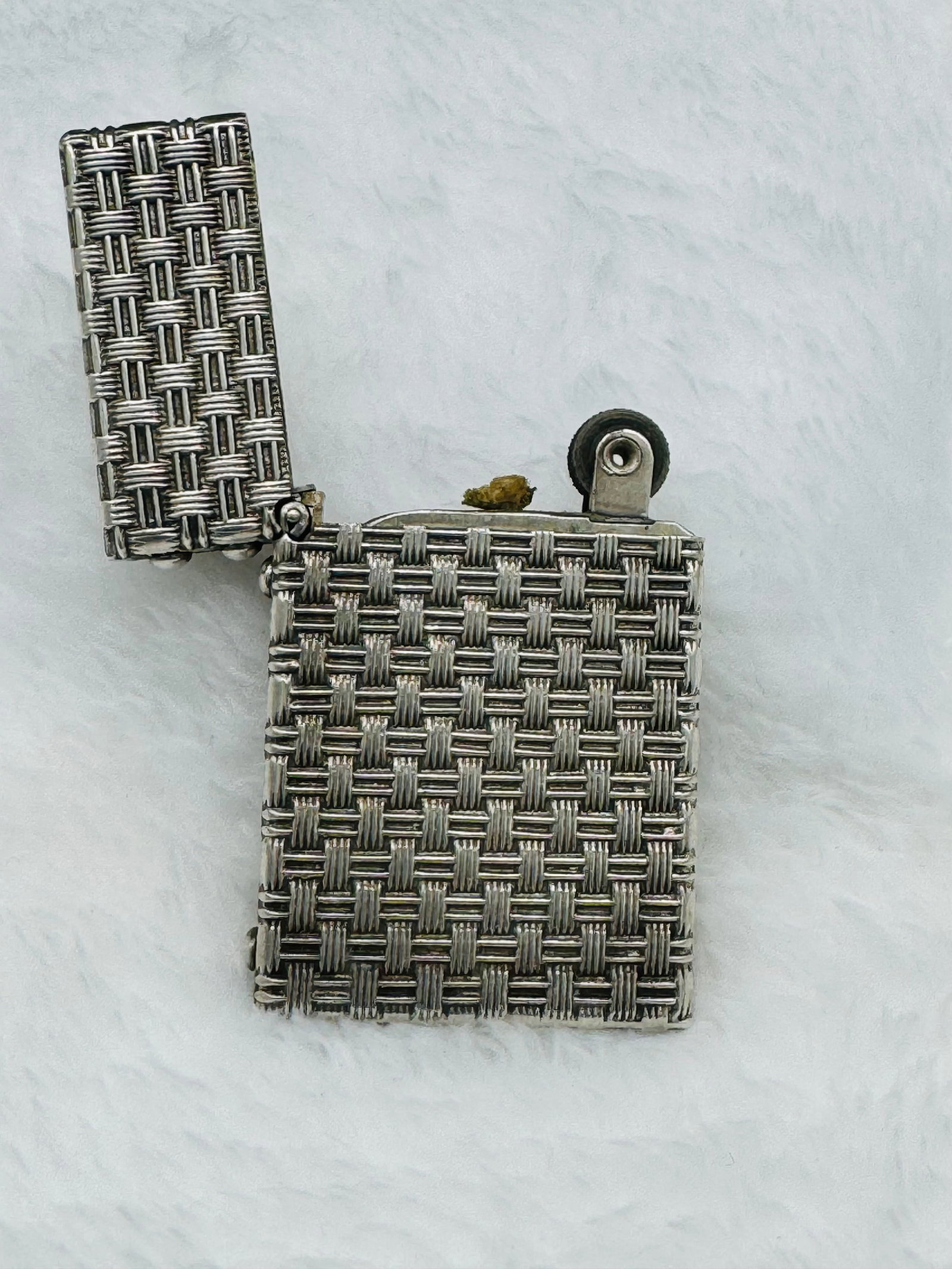 Tiffany & Co. Art Deco sterling silver lighter: One Tiffany & Co. Art Deco sterling silver basket weave lighter. See photo. Shows like new. Approx. 1 7/8 inch X 1 3/16 inch. Retail value based on comparable items.