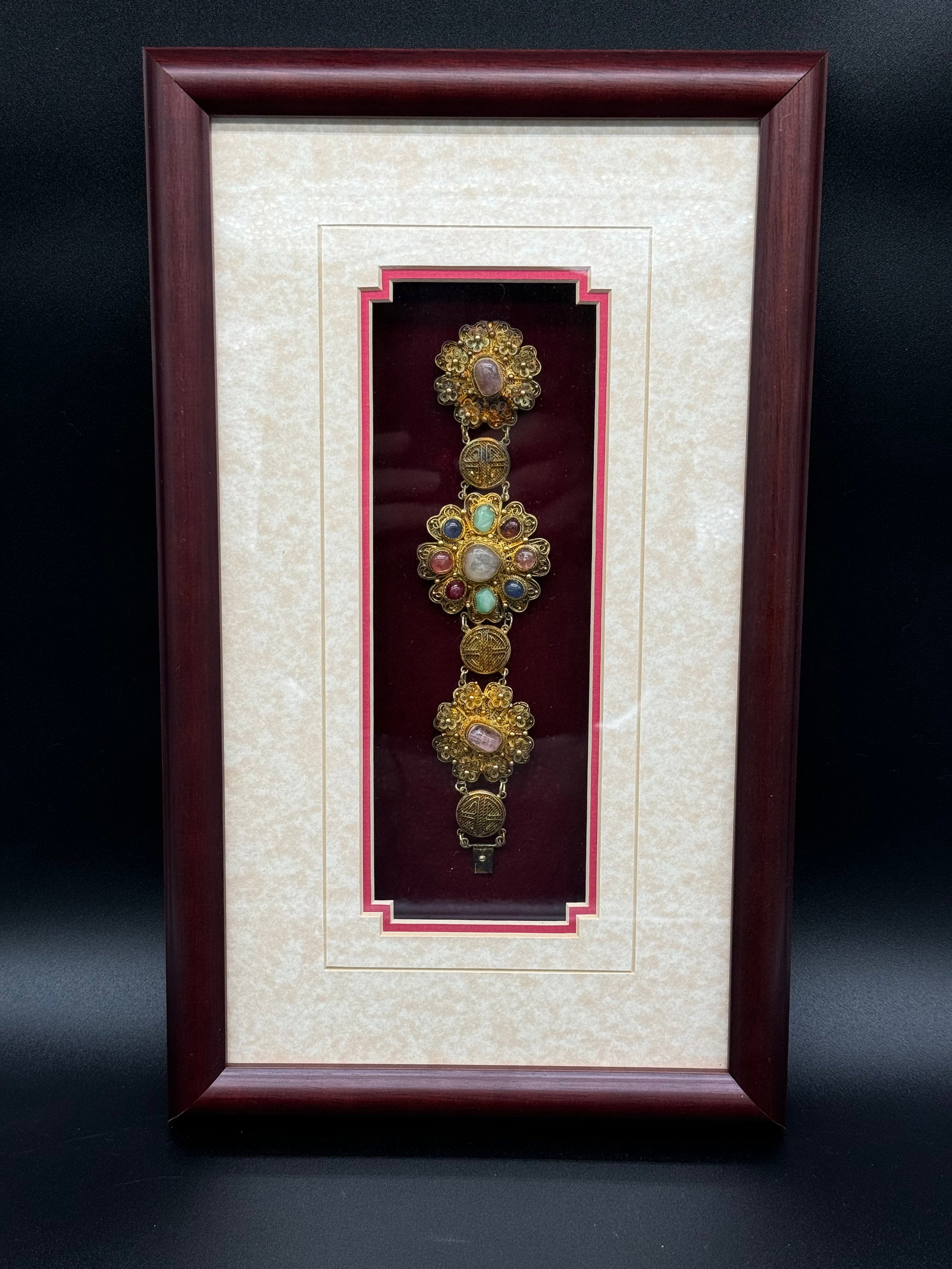 Wood framed antique Chinese bracelet w shadow box: One professionally wood framed antique Chinese bracelet in a shadow box, measures 13.5" x 8.25", he displayed bracelet measures 7.25" x 1.75", handmade filigree, typically between .800-.925 silver, go