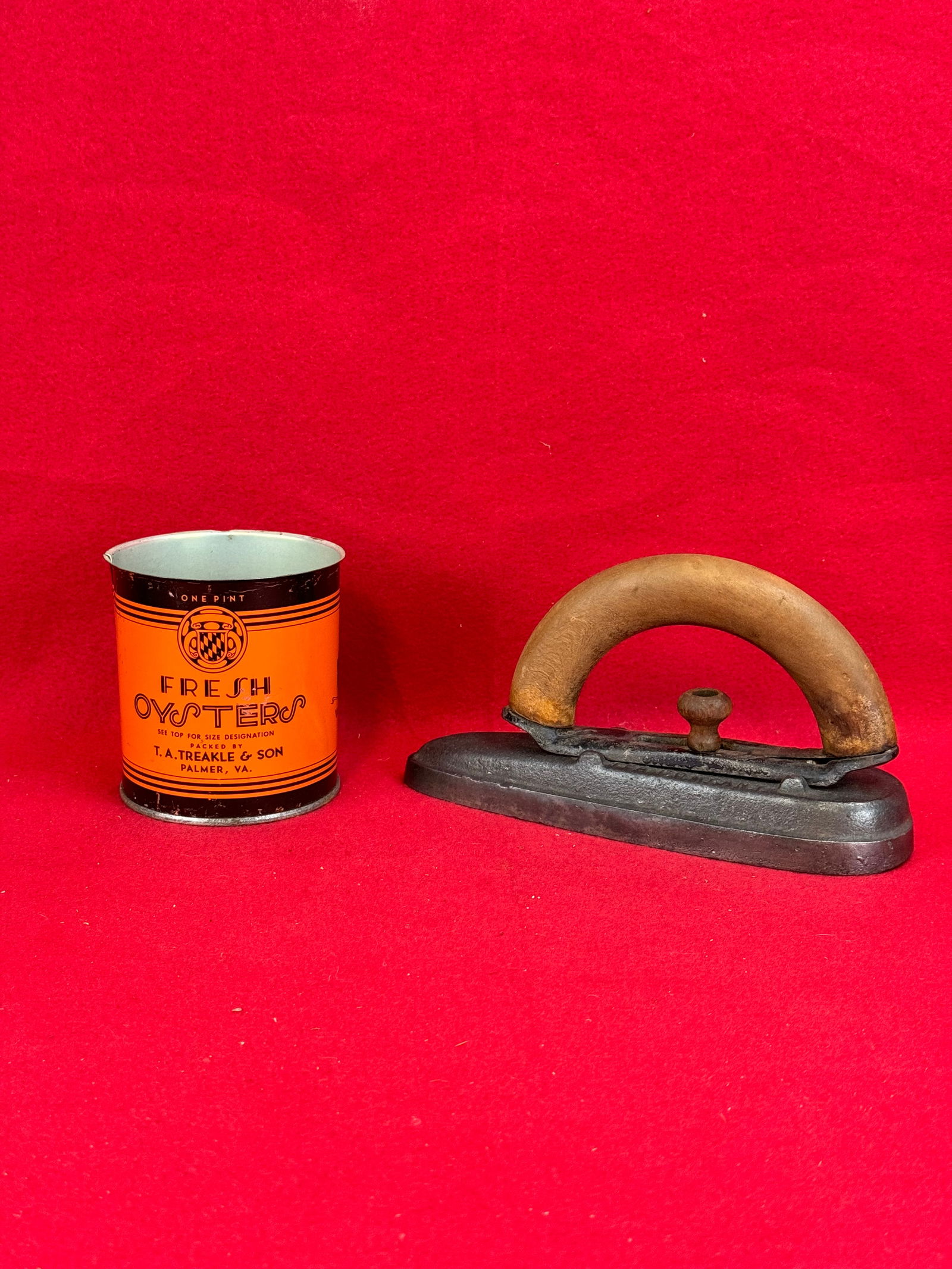 Grand Union Tea Flat Iron -T A Treakle Oyster Tin: Lot of two old advertising items to include a detachable handle flat iron marked Grand Union Tea Company together with a one pint size T. A. Treakle & Son Palmer Ma oyster tin. Condition as shown.