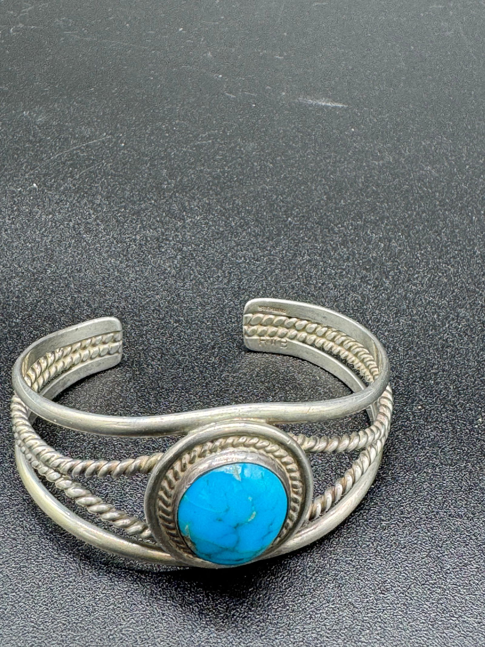 Navajo Sterling & Turquoise Cuff Bracelet signed: Vintage Navajo sterling silver set with turquoise cuff bracelet which is signed sterling and with the initials RWB. The bracelet has a weight of .96ozt and the condition is excellent