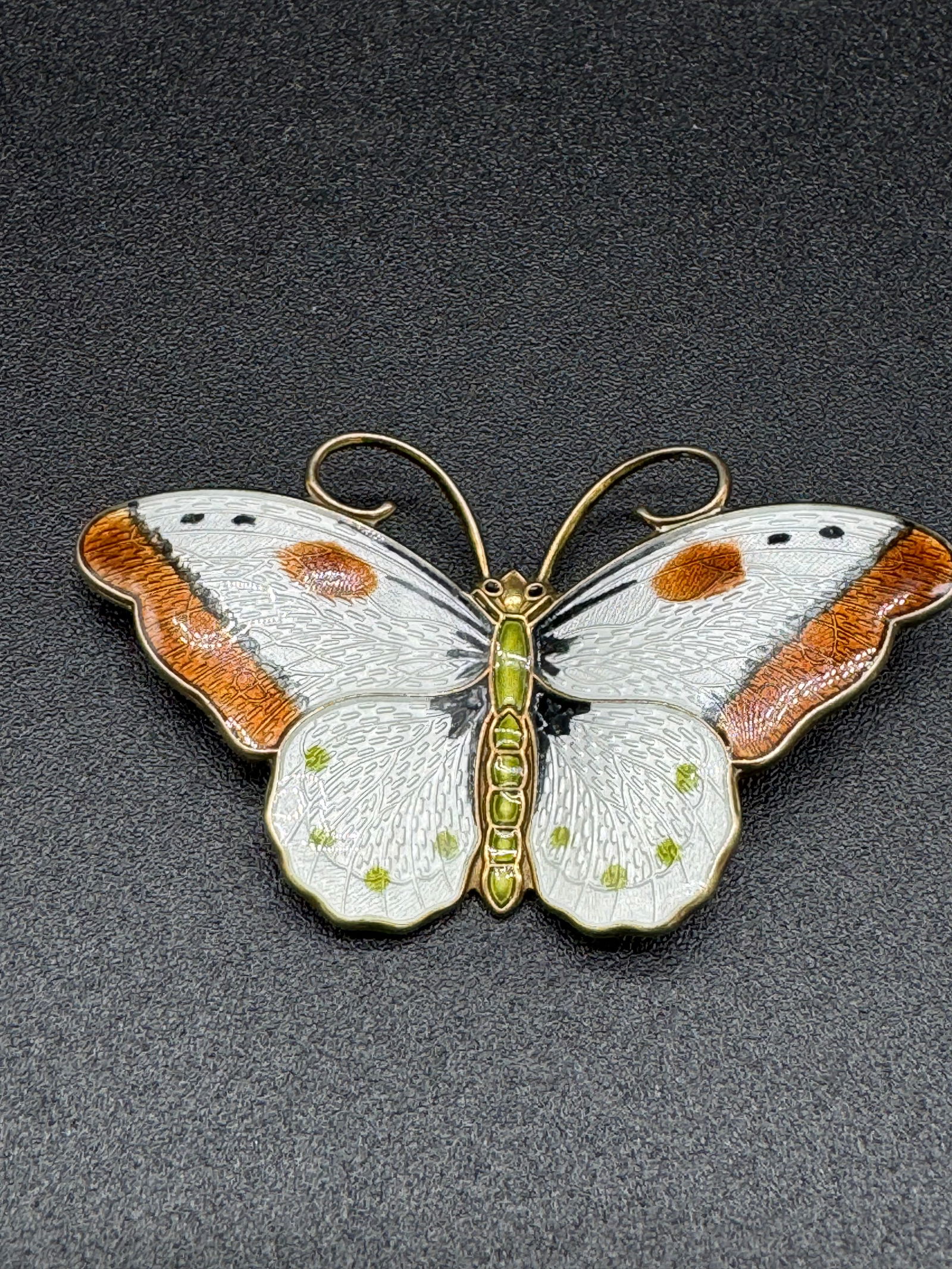 Silver Norwegian Guilloche Enamel Butterfly Pin: Vintagel large sterling silver and guilloche enamel pin in the form of a butterfly which measures approximately 2 1/2" across the wing and weights .54 ozt. Pin is marked sterling and Norway on the rev