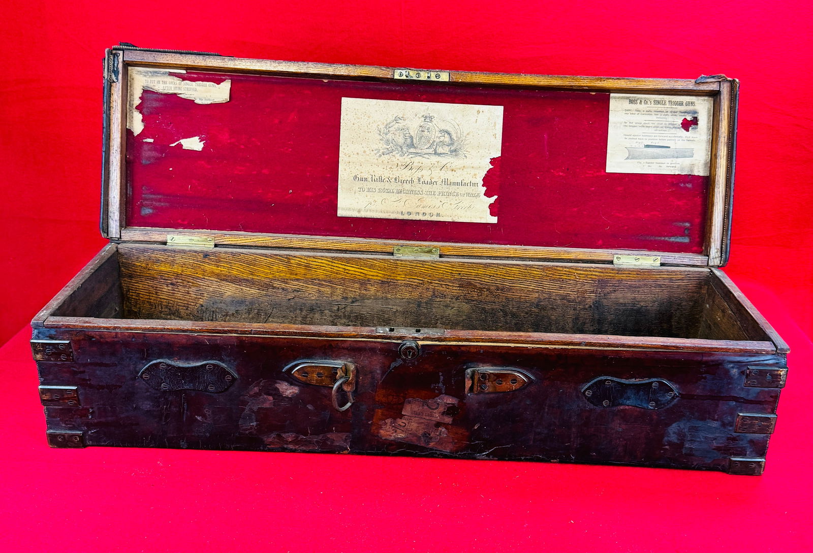 Antique Boss & Co Leather Covered Gun Case: Antique 19th century leather covered wooden gun case from the famous gunsmith Boss & Company London. Gun case measures approximately 33" long by 10" deep by 8" tall. Condition - rough as shown with mu