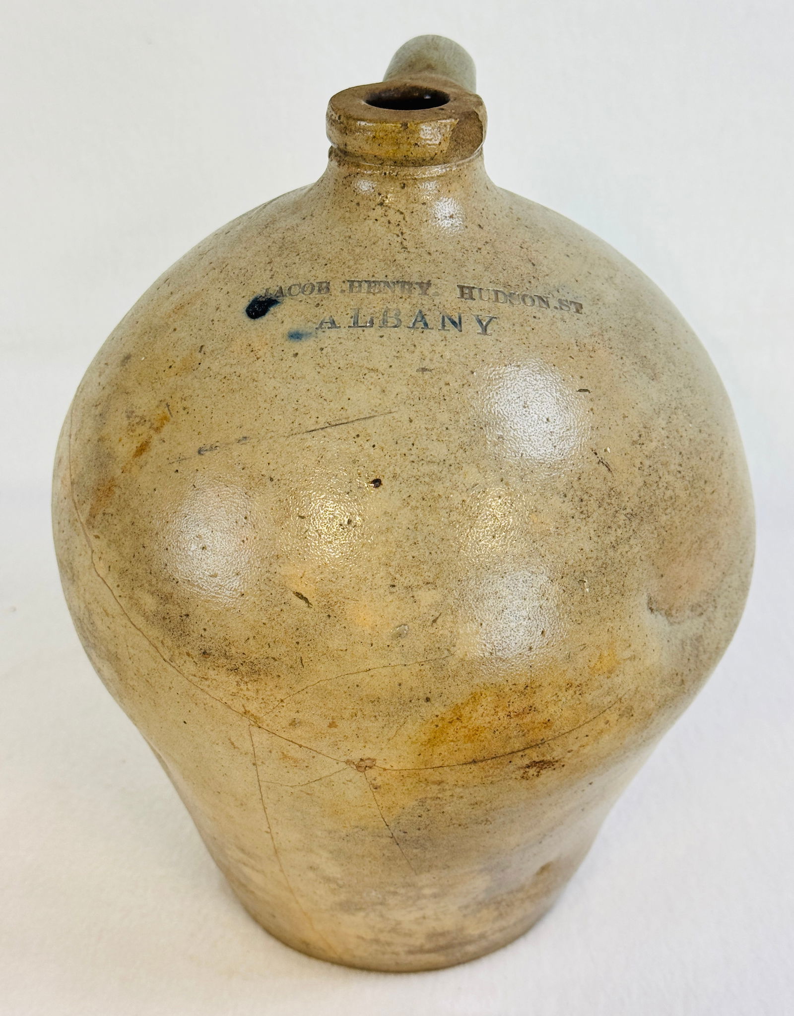 Jacob Henry Hudson St Albany Ovoid Jug: 11" ovoid stoneware jug stamped Jacob Henry Hudson St / Albany (1839-1845). Condition - poor with replaced handle and a number of body cracks