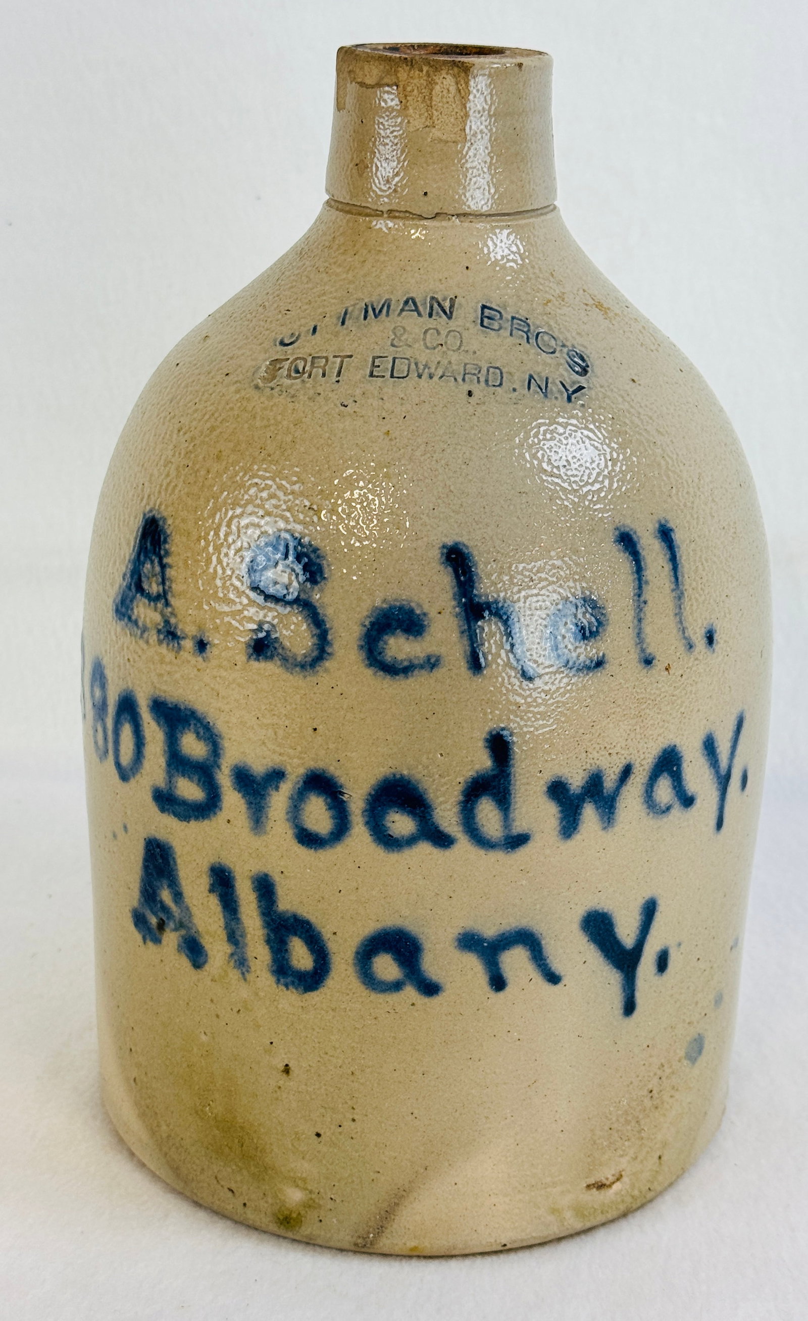 A Schell Script Advtg Jug Made By Ottman Bros: 11 3/4" straight sided stoneware script advertising jug for A Schell / 380 Broadway / Albany which was made and is stamped at shoulder by Ottman Bros / & Co / Fort Edward (1872-1892). Condition - seri
