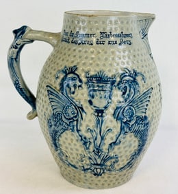 9.5" Bulbous Bl & Wh Molded Stoneware Pitcher