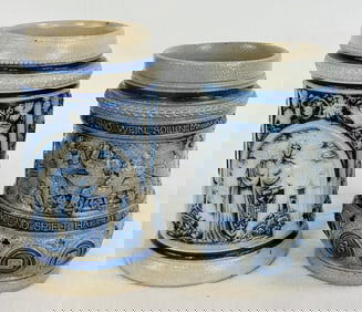 2 German Relief Molded Bl & Wh Stoneware Mugs