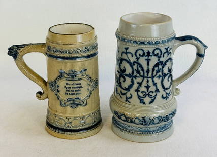 Lot 2 Whites Pottery Utica NY Stoneware Steins: Lot of 2 blue and white molded stoneware steins both made by the Whites Pottery Utica New York. Both steins are in excellent condition with one perfect and the other is the same except for a in the ma