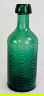 Medium Green G W Hoxie Premium Beer Bottle: 6 3/4" blown in mold with applied top medium emerald green beer bottle which is embossed G W Hoxie's / Premium / Beer. Condition - fine with just some minor surface wear and a few tiny surface dings.