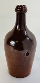 Early Mineral Slip Covered Stoneware Bottle