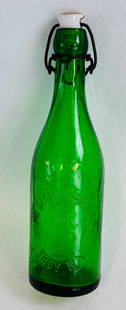 Emerald Green John Stanton Brewing Co Beer: 10" emerald green lightning stoppered beer bottle which is embossed John Stanton Brewing Co Troy N.Y. with their monogram at center. This pre-prohibition beer bottle is in fine condition with just som