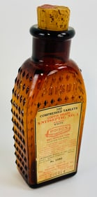 KU-18 Amber Norwich Coffin W Label 4 3/4"