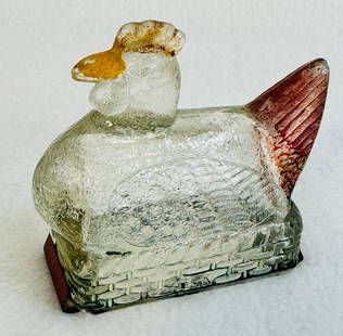 Hen On Nest Candy Container: 3 1/4" long clear glass figural candy container in the form of a hen on nest with its original tin closure and some of its original factory paint. Candy container is in fine condition being free of an