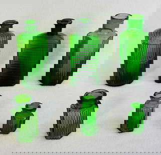 Lot Of 6 Emerald Green Poison Bottles: Lot of six emerald green blown in mold with tooled top poison bottles the tallest of which is approximately 6" tall. Condition - large round specimen lacks its stopper otherwise all appear to be in ex