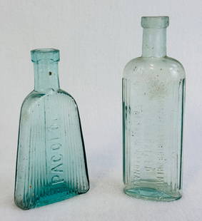 Lot 2 Aquamarine Poisons Pacolol & Burdall's: Lot of two aquamarine poison bottles which are blown in mold with tooled tops one embossed Pacolol and the other for Burdall's Ltd. Both bottles are in fine condition. Note: Most items in this auction