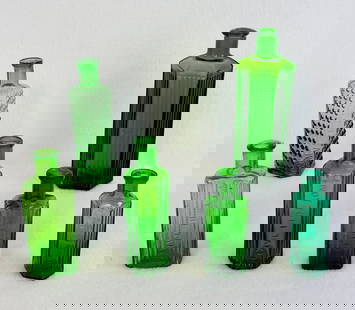 Lot Of 6 Emerald Green Poison Bottles: Lot of six emerald green poison bottles of which all but the largest which is 6 1/4" tall and is ABM are blown in mold with tooled tops and are embossed in a panel "Not To Be Taken". Condition - large