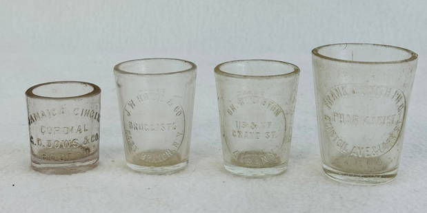 Lot 4 Pharmacy Dose Glasses: Lot of four clear pharmacy dose glasses to include a Dr R Liston Albany NY; Frank J. Smith PH G Clinton Ave & Lark St Albany NY; J W Hall & Co East Branch N.Y.' and finally a Jamaica Ginger Cordial G