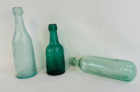 Lot 3 Soda & Beers: Lot of three soda and beer bottles to include a 9 1/4" aquamarine bottle embossed Milwaukee Lager Bottled By H Hilke Troy N.Y. (rare but has a crack at side and some stain); medium green squat embosse
