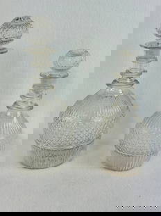 Lot 2 Blown Three Mold Decanters: Lot of two circa 1825-1840 blown three mold decanters in clear glass and having their correct stoppers. Both decanters have pontil marked bases and both are in excellent condition with just a trace of