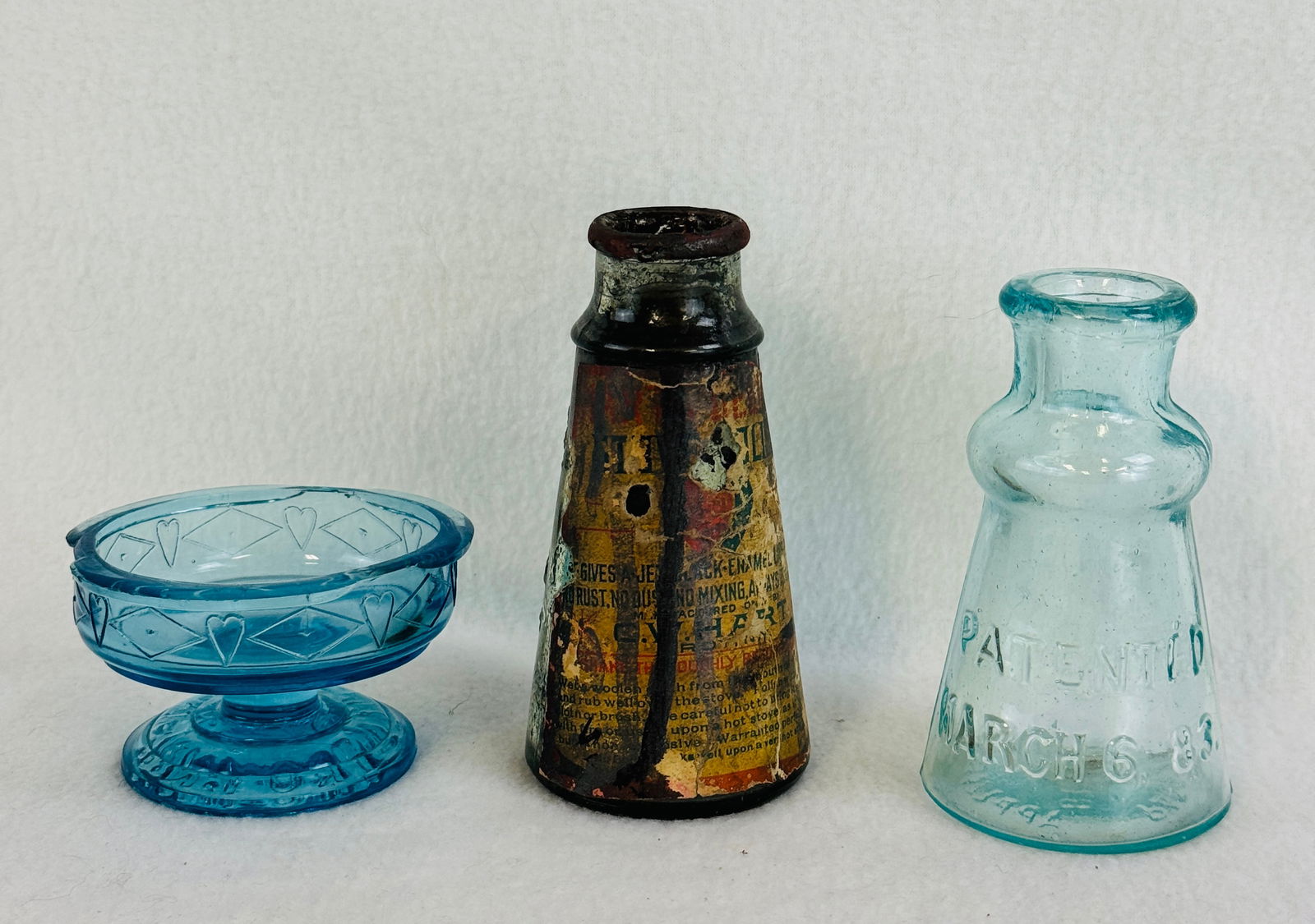 Lot 3 Including C W Hart Stove Blacking: Lot of three to include a 4 1/2" clear tapered form C W Hart's Stove Polish Troy New York which retains approximately 70% of its original worn label and some remnants of its original contents; Light b