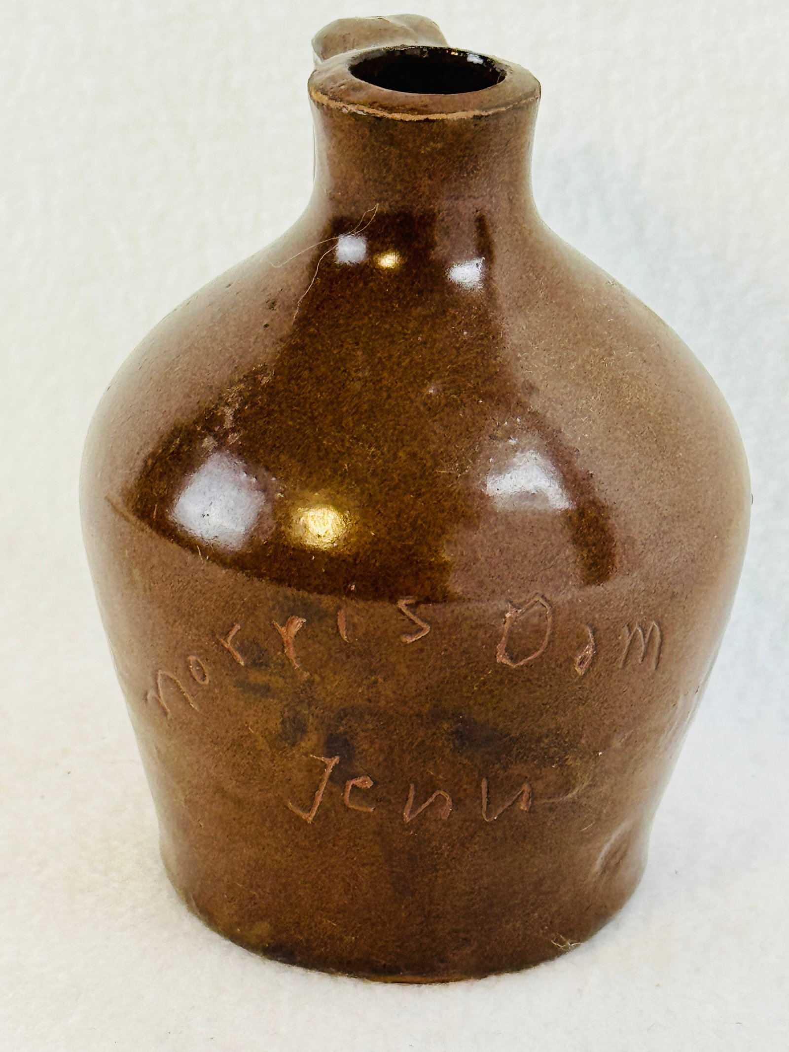 Miniature Scratch Jug Morris Dam Tenn.: 4 1/8" slip glazed miniature scratch jug which is hand incised on the front Morris Dam / Tenn.. Mini jug is in excellent condition. Note: Most items in this auction we will offer our in-house shipping